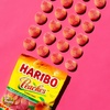 image:imageHARIBO Gummi Candy FizzyCola Gummy Candy Soda Bottles 5 Ounce Share Size Bags Pack of 12 Delicious Soft amp Chewy Sweet Snacks Sour amp Tangy Cola FlavorPeach